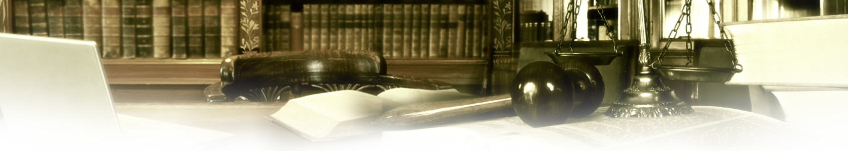 Law books and a computer on a table